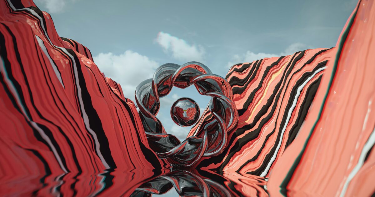 赤と黒の縞模様の谷間に配置されたメタリックな抽象オブジェクト