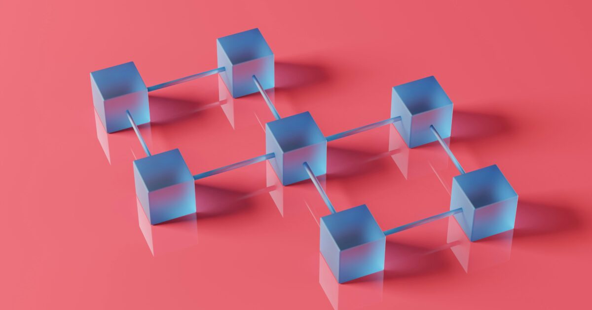 ピンクの背景に青い立方体がネットワーク状に配置されたブロックチェーンの3Dアート